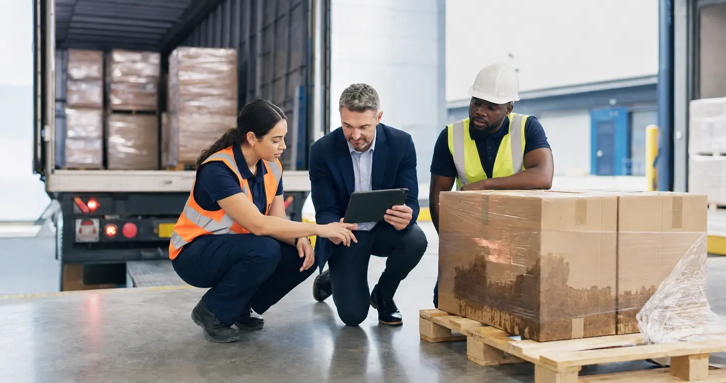 Insurance and warehouse professionals documenting a cargo claim